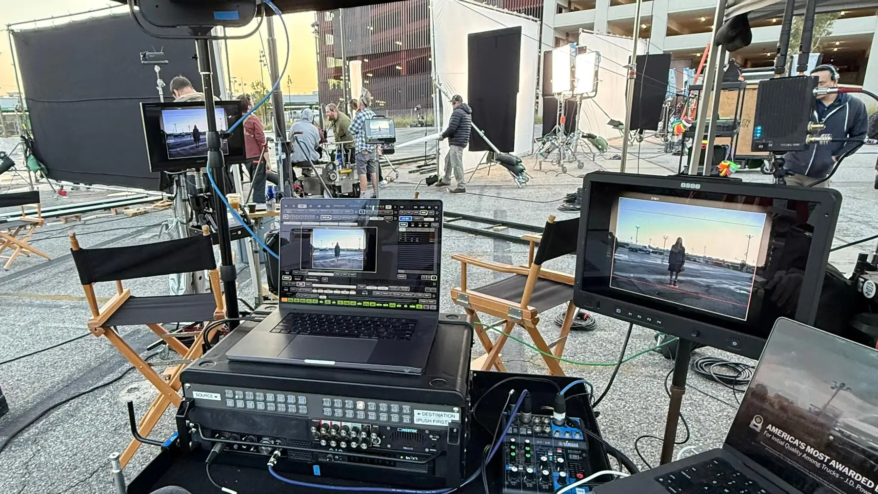 Monitors and routing gear arranged at a video village on an interior set.